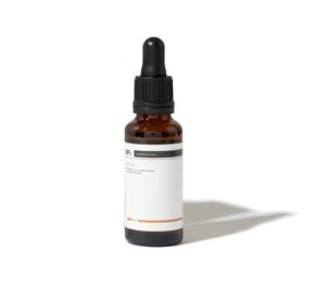 Bfx VCE10 serum in a glass bottle on a white background