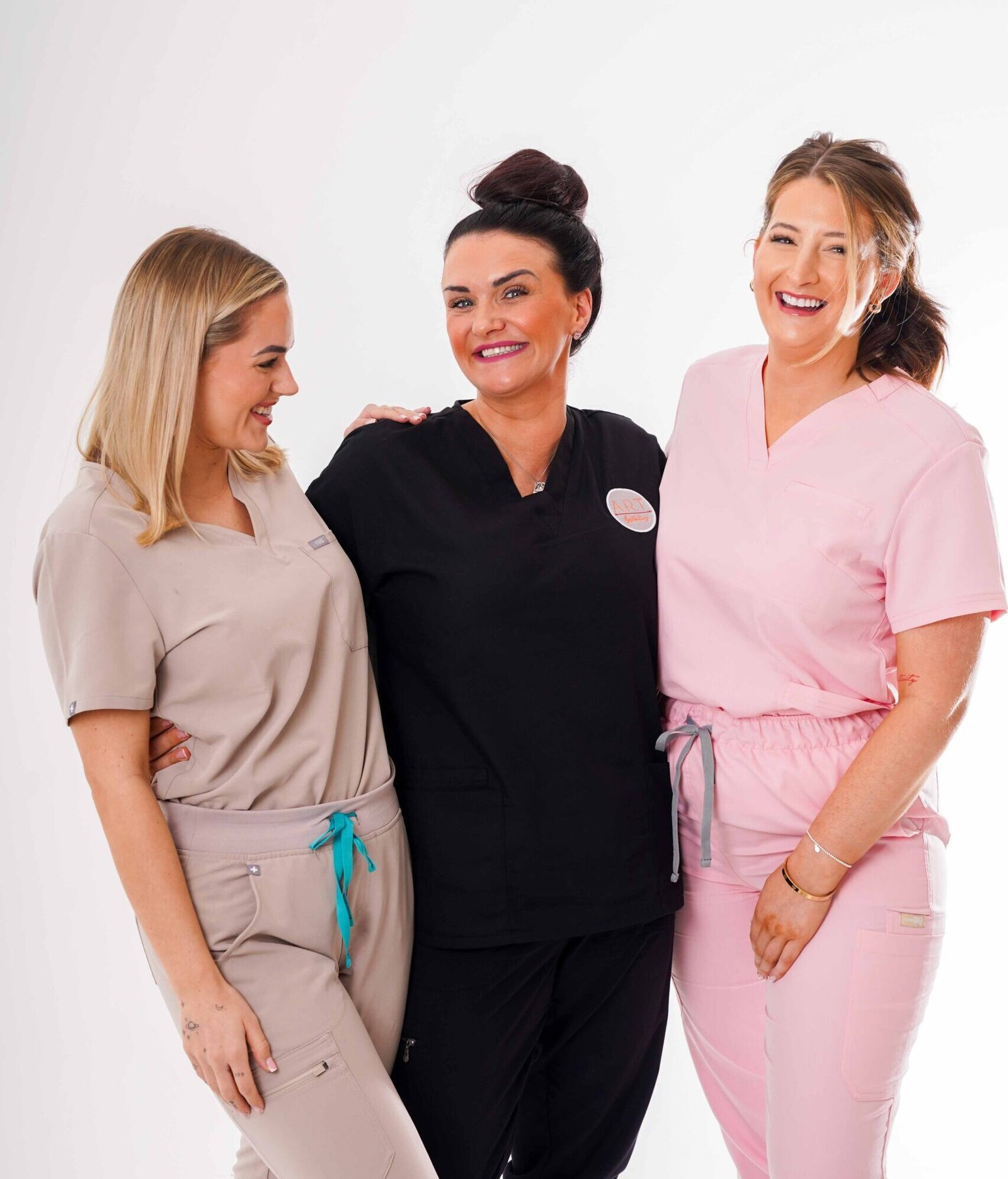 three bossface stockists facing each other laughing
