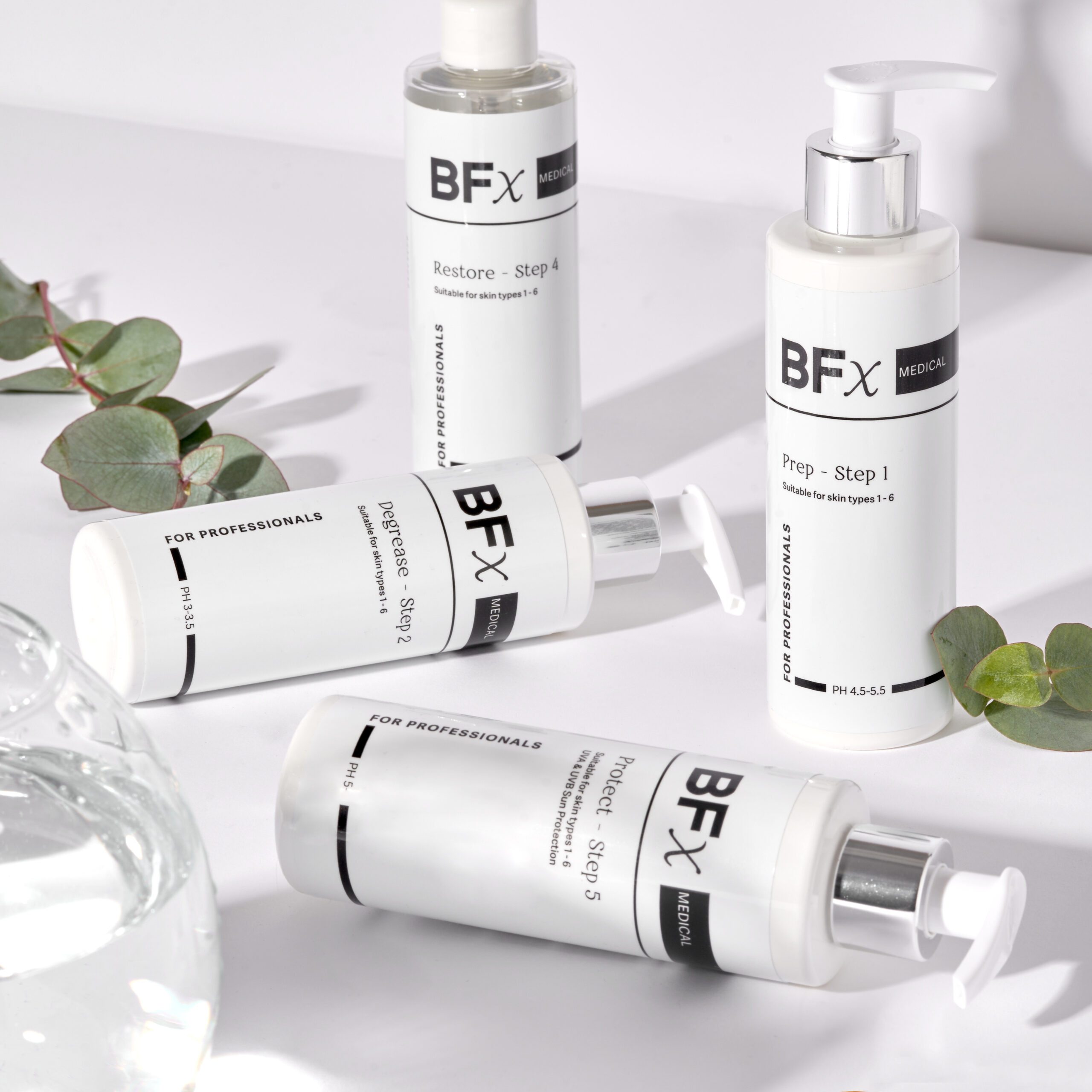BFx Medi Professional products lying flat on white surface with leaves